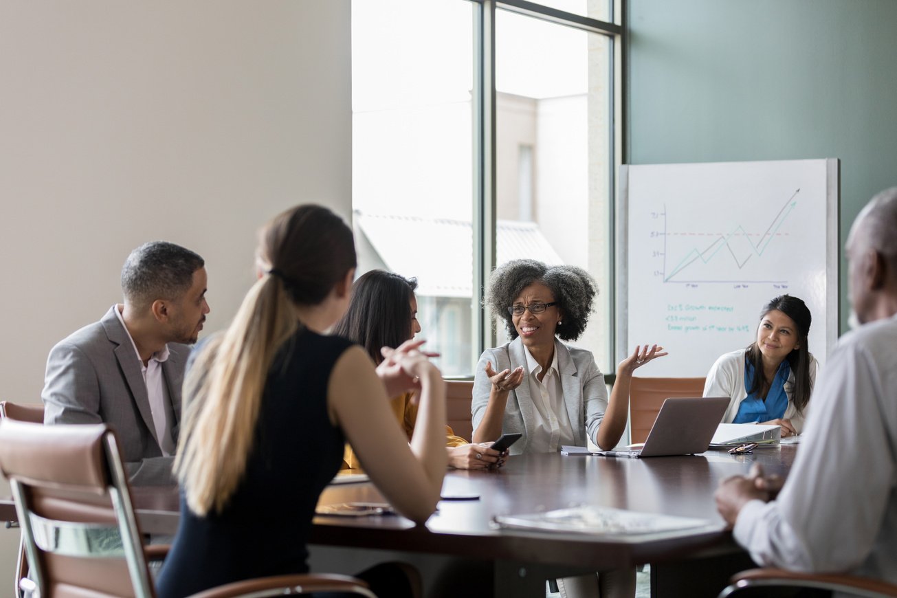 Multi-ethnic board members meet to set direction for non-profit